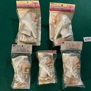 Premier porcelain Santa heads and arms two sizes new in packages no flaws